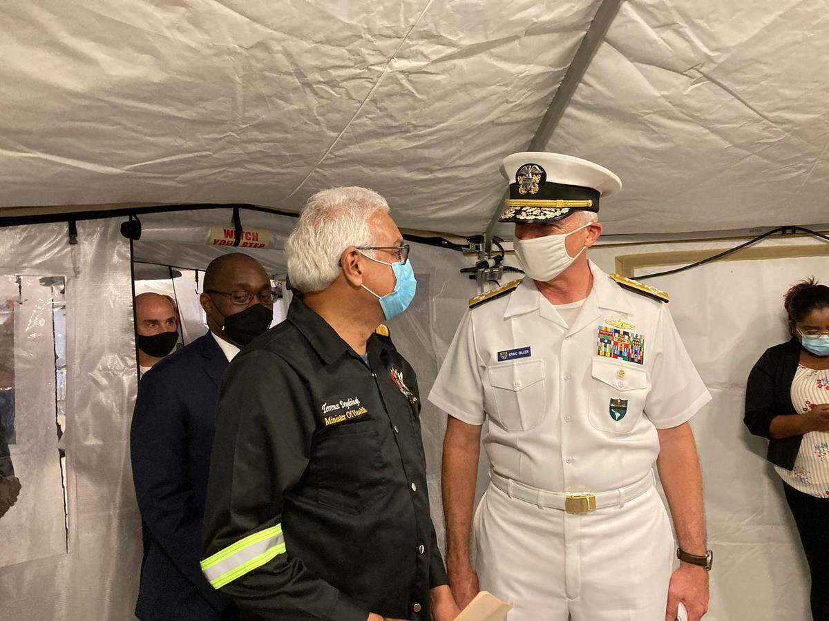 Trinidad Health Minister Terrence Deyalsingh, left, and U.S. Southern Command Adm. Craig Faller are visiting a 28-bed field hospital donated by the U.S. at the Jean Pierre Complex in Port of Spain, Trinidad, on Aug. 11, 2021.