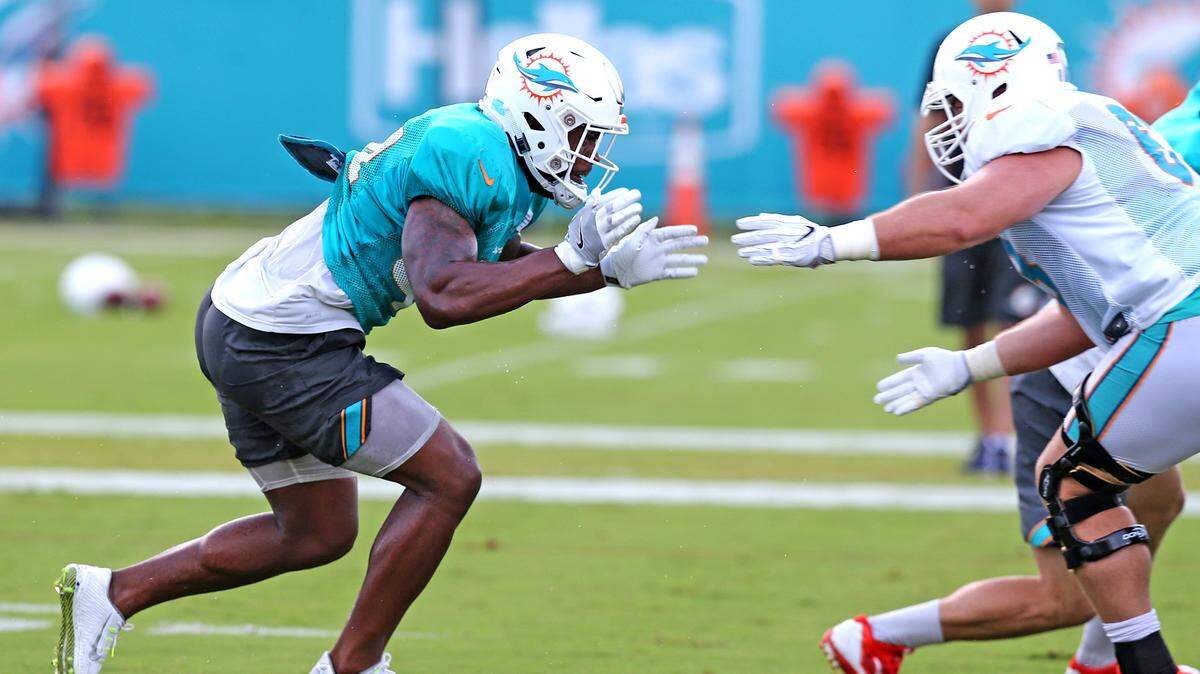 Miami Dolphins linebacker Stephone Anthony (44) prepares to collide with center Mike Matthews (63) during training camp on Aug. 1. Anthony has struggled in two preseason games.