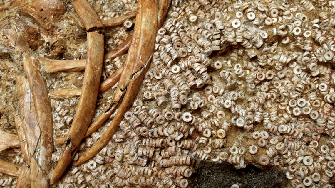 Hundreds of thousands of beads found in an ancient tomb were likely part of elaborate clothes for powerful women, researchers said.