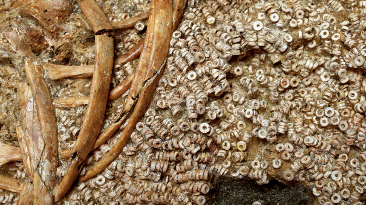 Hundreds of thousands of beads found in an ancient tomb were likely part of elaborate clothes for powerful women, researchers said.