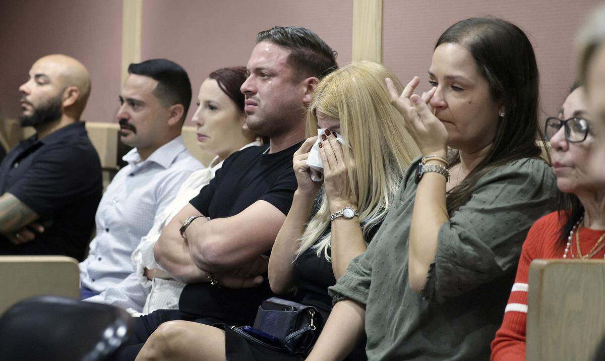 People in court react to the victim’s impact statement read by Hollywood police Officer Henry Martinez on Tuesday, Dec. 2, 2025. Martinez was best friends with Hollywood Police Officer Yandy Chirino, and was on the scene when he was shot and killed. Jason Banegas pleaded guilty in October to the 2021 shooting death of Hollywood Police Officer Yandy Chirino. (Mike Stocker/South Florida Sun Sentinel)