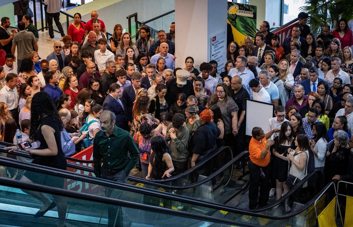 Miami, Florida - May 25, 2023 - Parents and nominees wait to get into the James L. Knight Center in downtown Miami before the start of the 65th Annual Silver Knight Awards Ceremony presented by the Miami Herald & el Nuevo Herald.