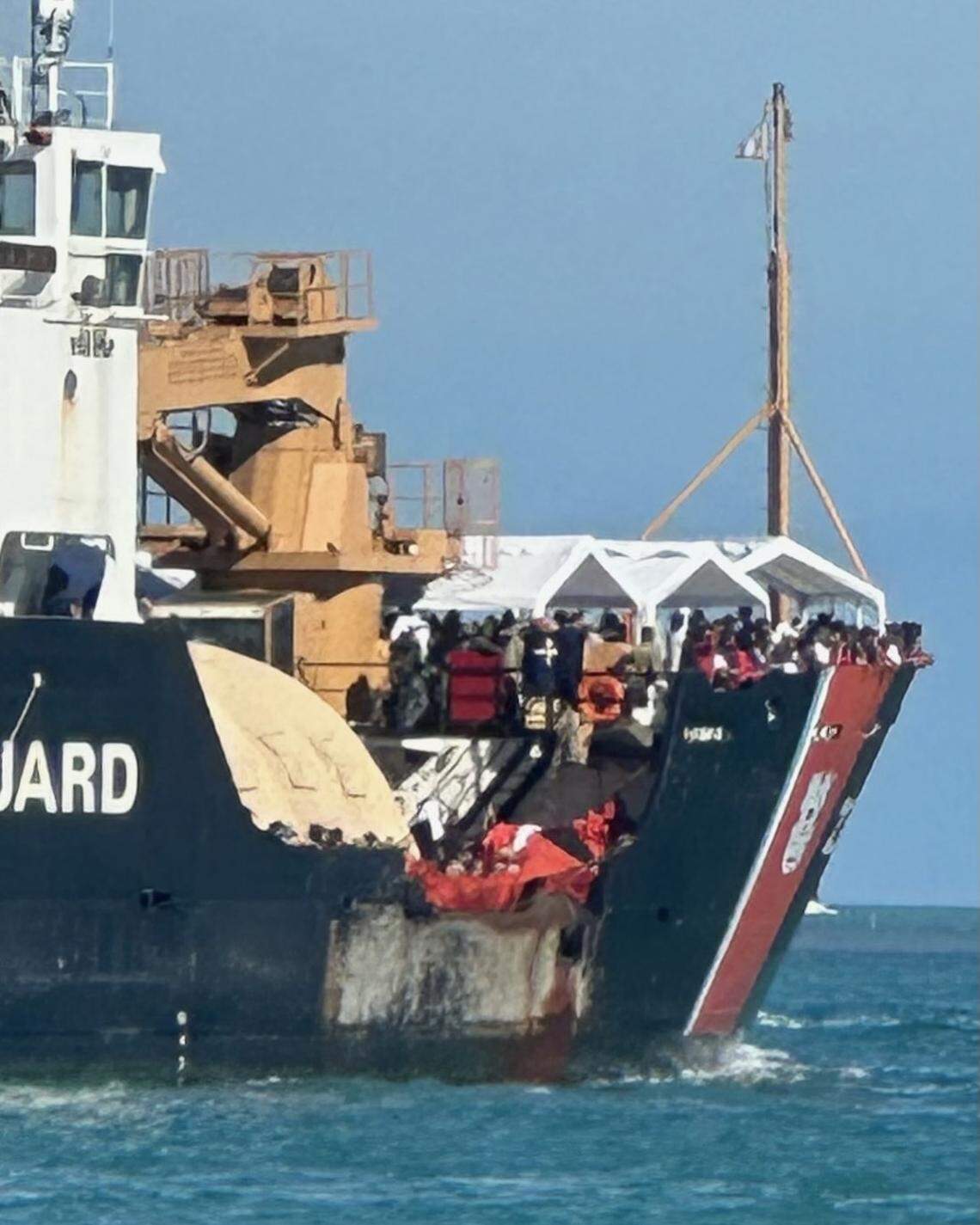 Hundreds of Cuban migrants line the deck aboard a U.S. Coast Guard buoy tender cutter as it approaches the Coast Guard Sector Key West on Thursday, Jan. 5, 2022. In total, 337 migrants who had landed at Dry Tortugas National Park were shipped by the Coast Guard to Key West on Thursday. From there, they will be transported to U.S. Border Patrol for processing, the Coast Guard said.