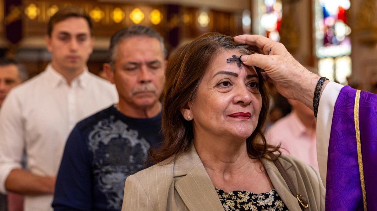 Congregants at The Gesu Church in downtown Miami line up for the ritual marking of Ash Wednesday.