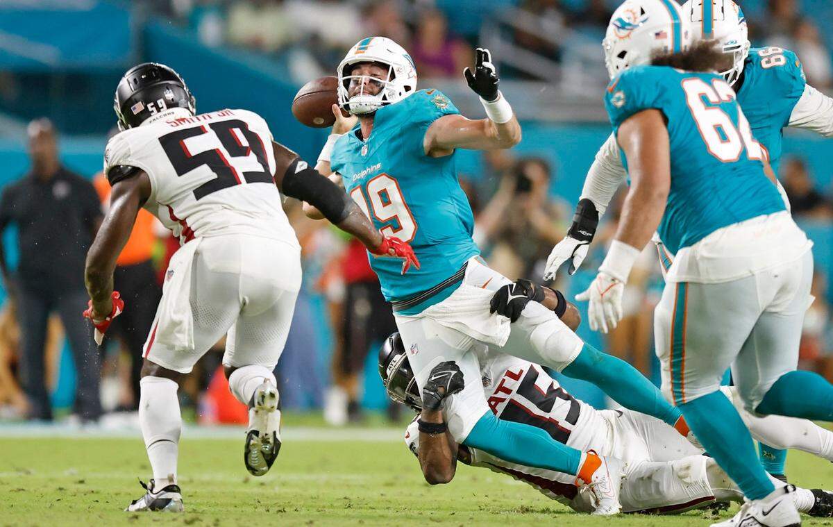 Miami Dolphins quarterback Skylar Thompson (19) throws an incomplete pass as Thompson is taken down by Atlanta Falcons linebacker Mike Jones Jr. (45) in the fourth quarter during a preseason game at Hard Rock Stadium in Miami Gardens on Friday, August 11, 2023.