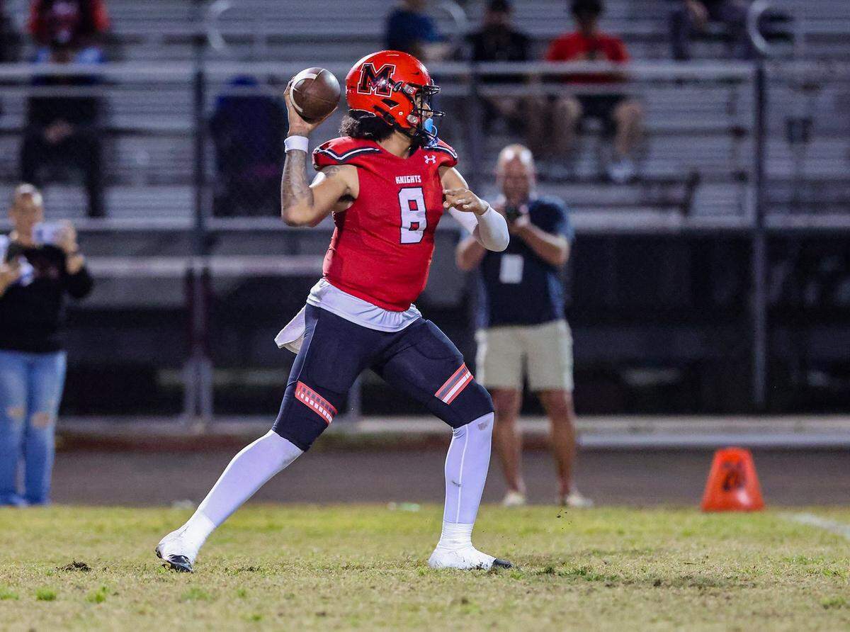 Monarch Knights Aj Hairston, quarterback (8), gets ready to throw the ball, during the state semifinal football game against the Mandarin Mustangs, at Coconut Creek High School, on Friday December 01, 2023.