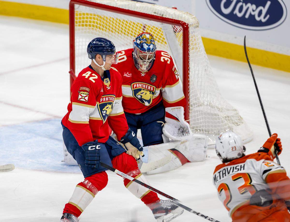 “Florida Panthers defenseman Gustav Forsling (42) helps defend as goaltender Spencer Knight (30) blocks a shot by Anaheim Ducks center Mason McTavish (23) during the first period of an NHL game at Amerant Bank Arena on Saturday, Jan. 18, 2025, in Sunrise, Fla.