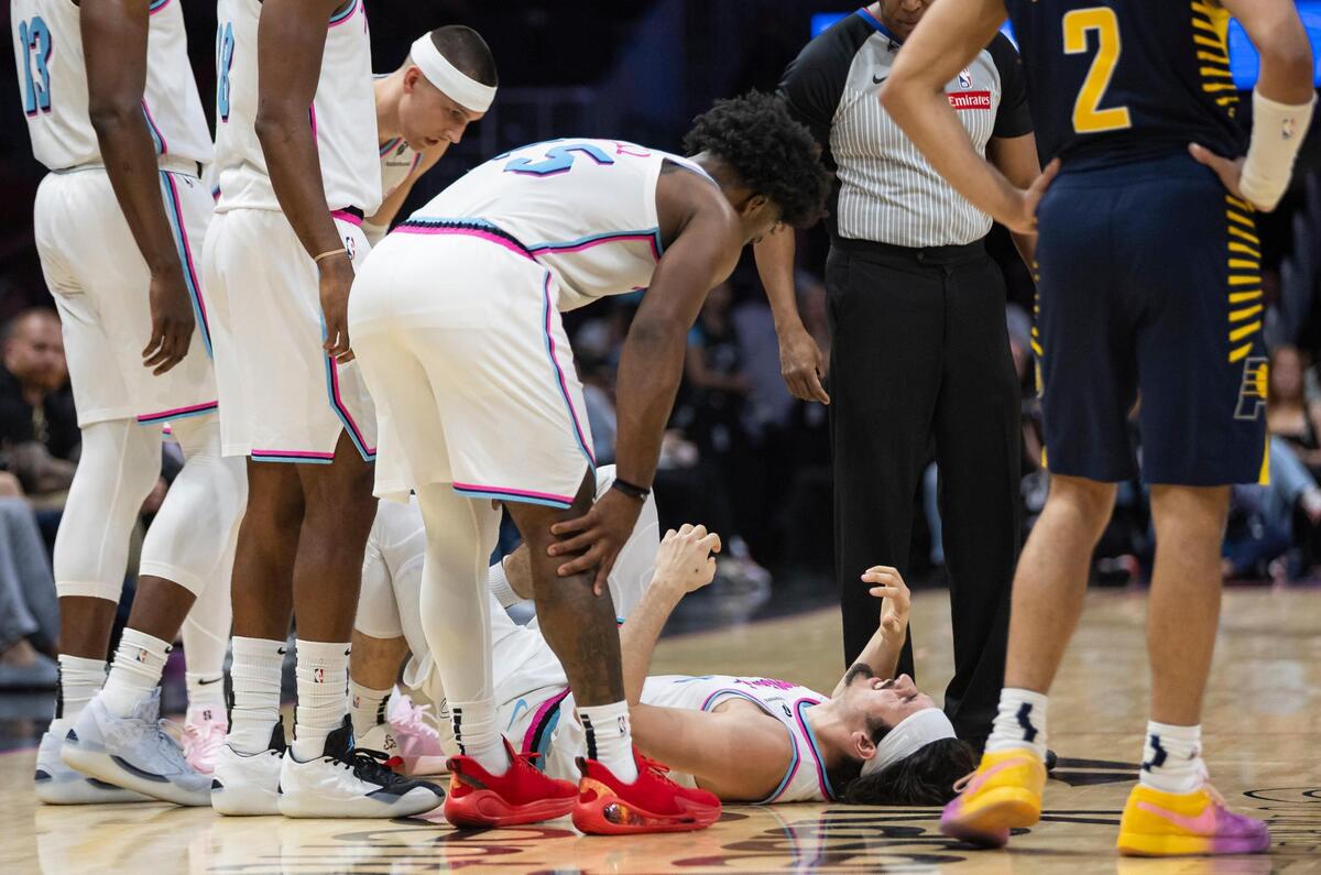 Miami Heat guard Jaime Jaquez Jr. (11) reacts after sustaining an injury in the second half of his NBA game against the Indiana Pacers at the Kaseya Center on Friday, Feb. 28, 2025, in downtown Miami, Fla.
