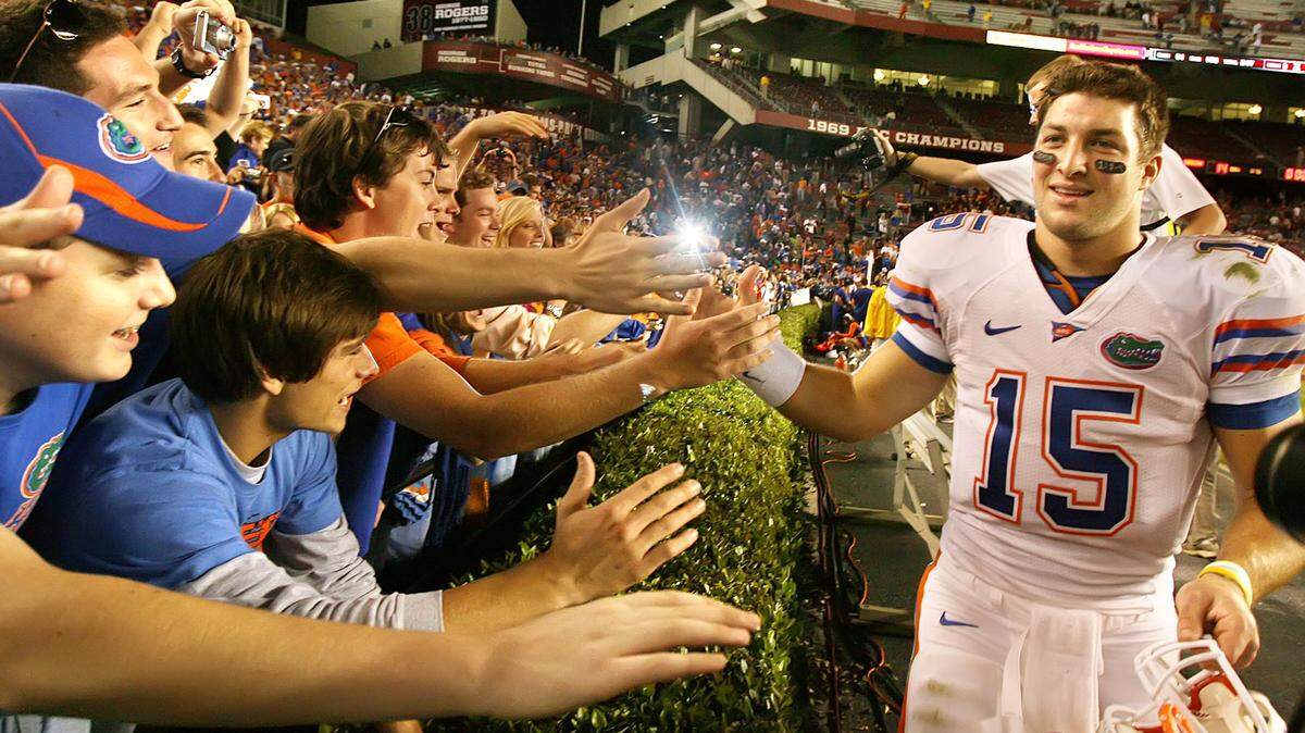 Florida quarterback Tim Tebow celebrates with fans after the Gators defeated South Carolina at Williams-Brice Stadium in Columbia, S.C., on November 14, 2009.