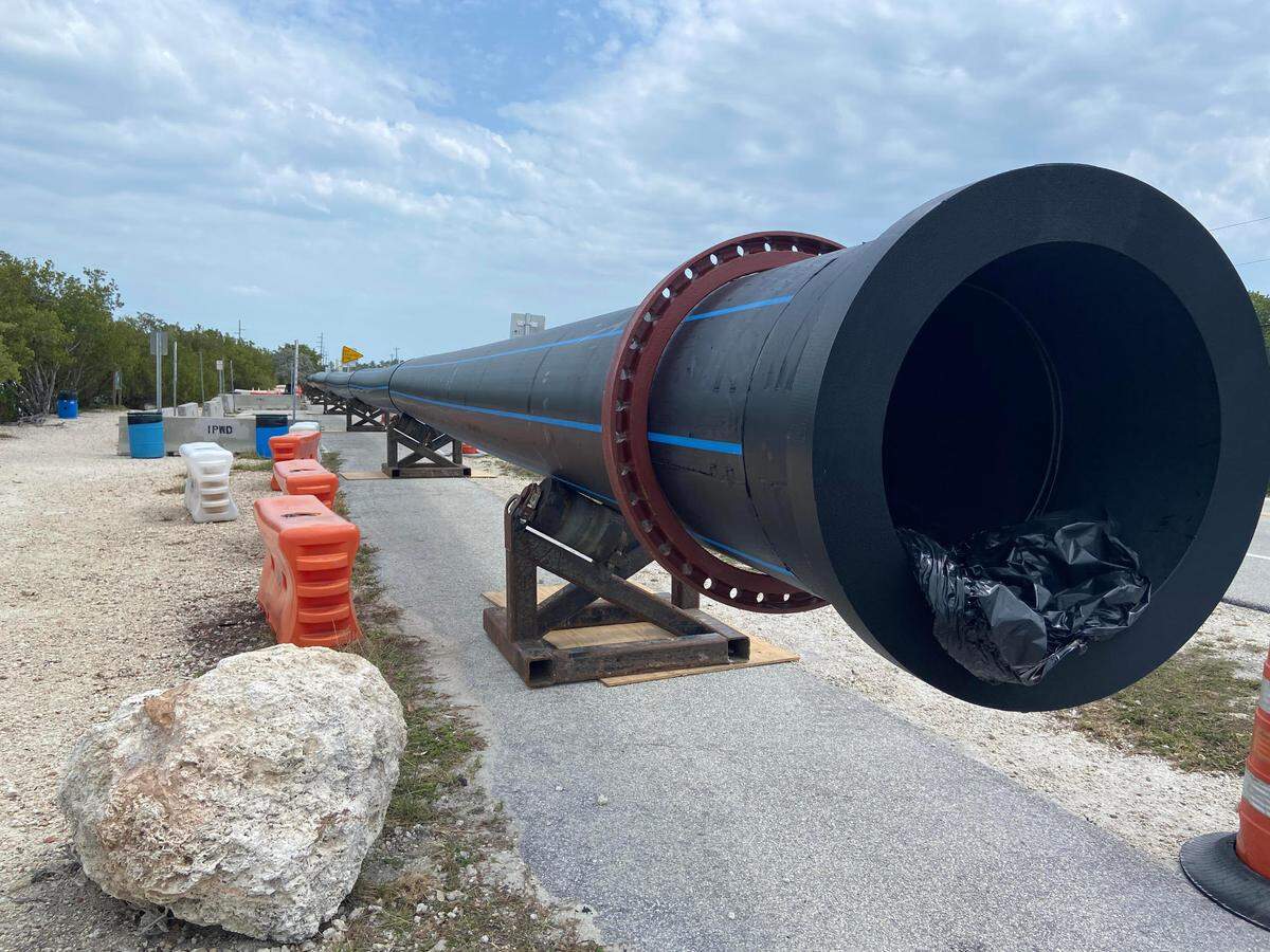 Water pipes are propped up on the side of U.S. 1 at mile marker 79 in the Florida Keys Tuesday, March 14, 2023. The pipes are part of a $42 million project to replace aging infrastructure in the Upper Keys.