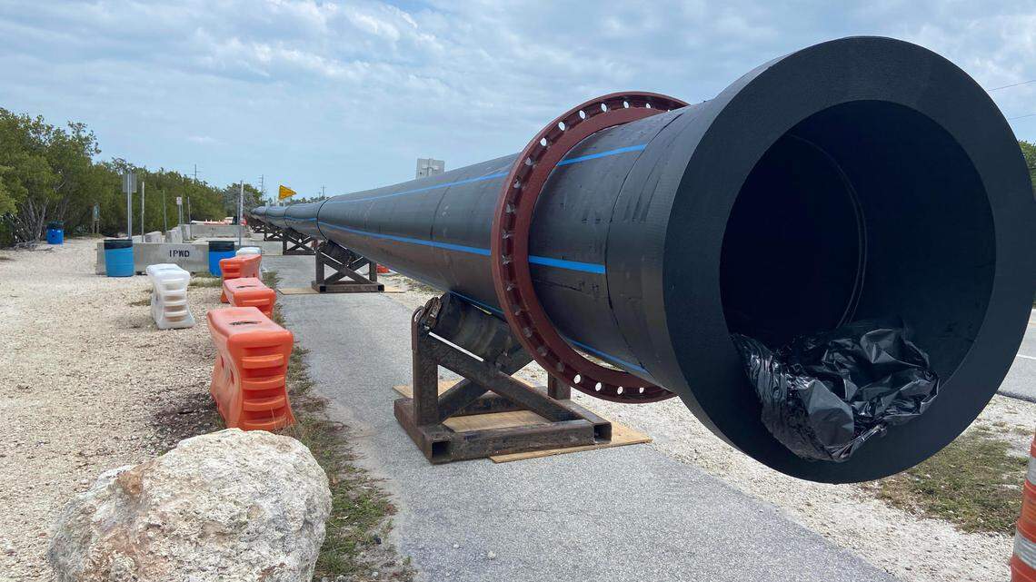 Water pipes are propped up on the side of U.S. 1 at mile marker 79 in the Florida Keys Tuesday, March 14, 2023. The pipes are part of a $42 million project to replace aging infrastructure in the Upper Keys.