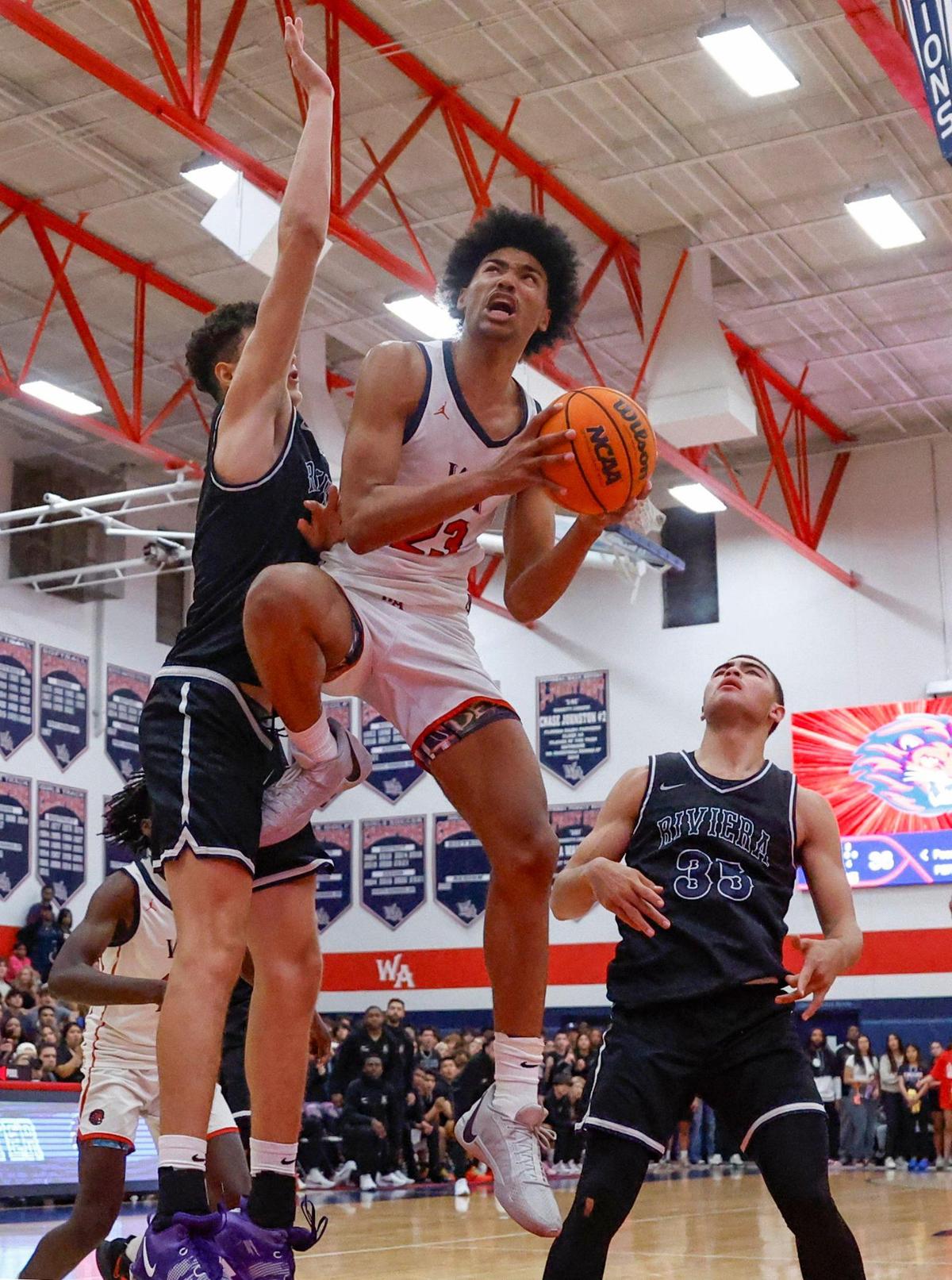 Westminster Academy Lions Alex Constanza (23) drives to the basket as Riviera’s Gustavo Guimaraes (11) defends during boy’s basketball FHSAA Regional Finals at Westminster Academy School in Fort Lauderdale, Fl on Friday, February 23, 2024.