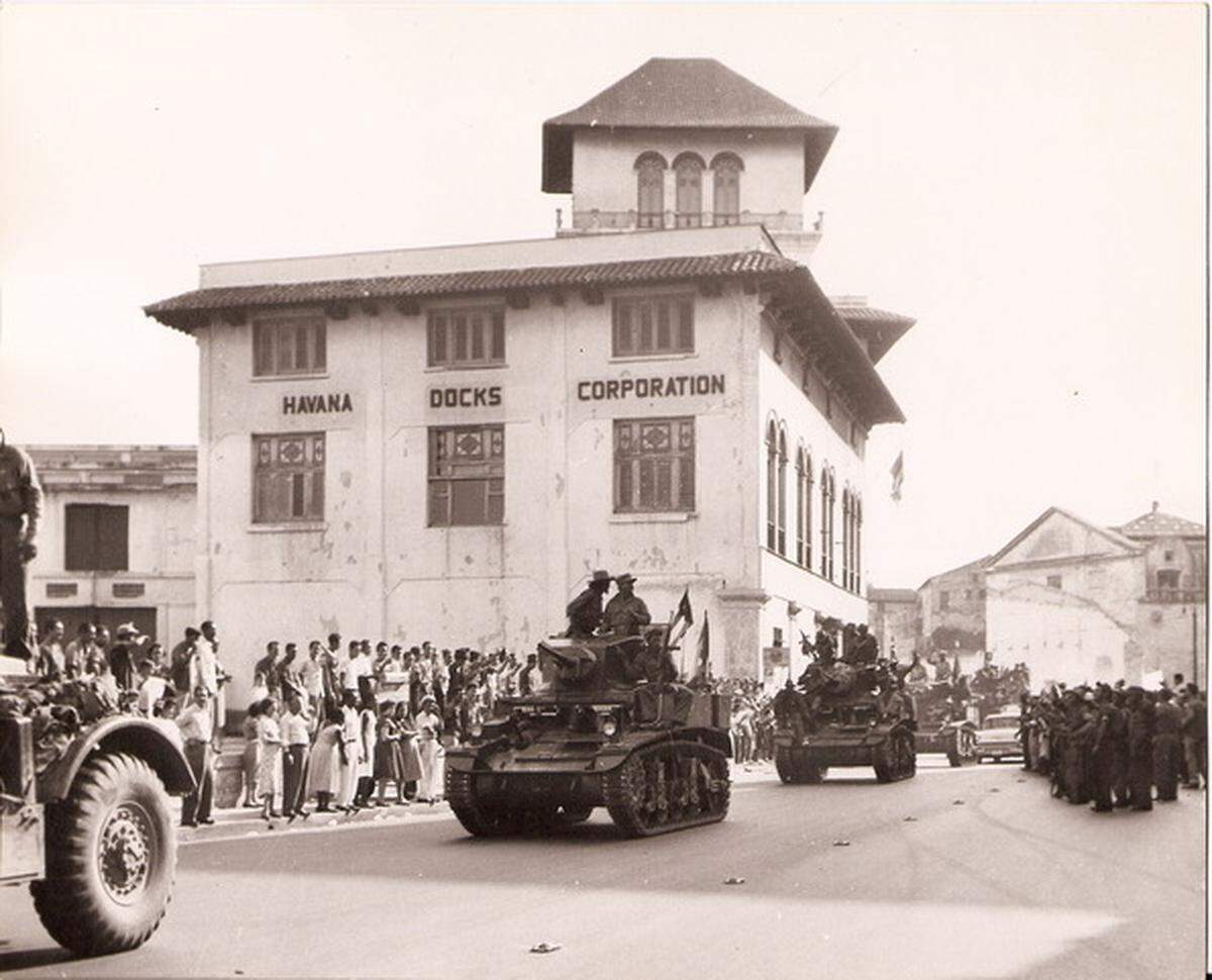 Fidel Castro’s guerrilla fighters on armored tanks parade in front of Havana Docks building in the port of Havana. The photo was probably taken on November 1960, when the property was nationalized, said Mickael Behn, who is recognized by the U.S. government as the rightful property owner.