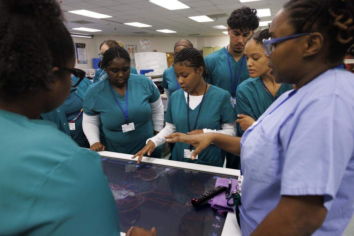 Students in the Surgical Technology program least from their instructor during the day on Tuesday, Oct. 21, 2025, at Lindsey Hopkins Technical College in downtown Miami.