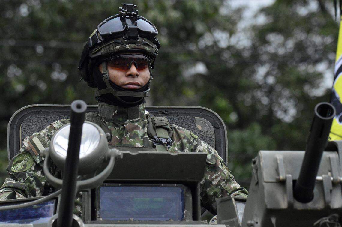 A Colombian soldier deployed in Cucuta, keeps watch from a military vehicle at the border crossing with neighboring Venezuela, on January 3, 2026.