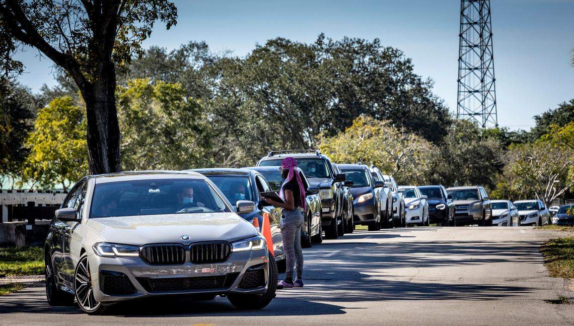 Pembroke Pines, Florida, December 23, 2021 - Cars line up to enter the Covid-19 Testing site at CB Smith Park in Broward County.
