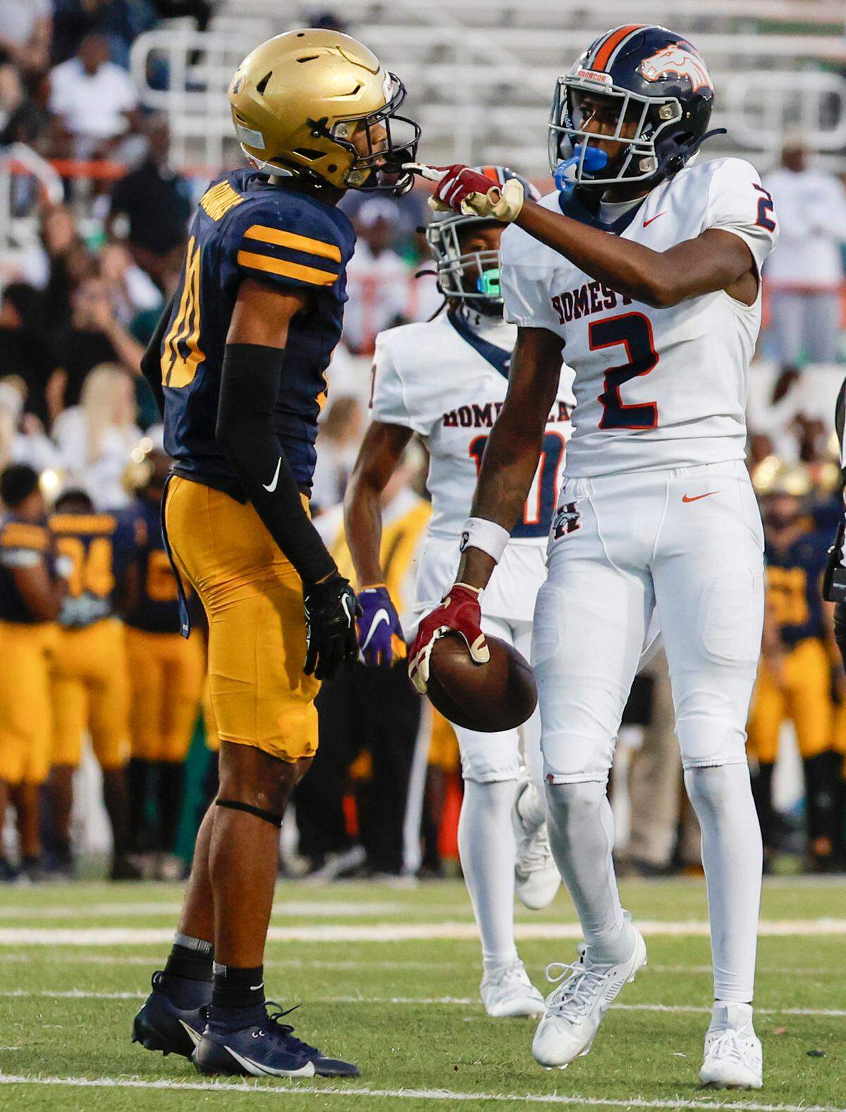 Homestead Broncos Cortez Mills (2) signals for a first down pass reception as St. Thomas Aquinas Bryant Allen (10) reacts in the second half of the Class 3M state championships at Bragg Memorial Stadium in Tallahassee, Florida on Saturday, December 9, 2023.