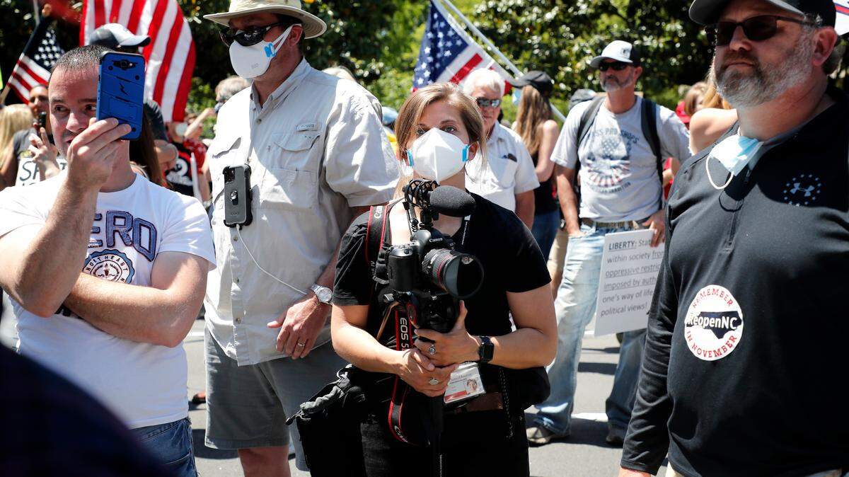 News & Observer staff photojournalist Julia Wall during the ReOpenNC protest in Raleigh, N.C., Tuesday, April 28, 2020.