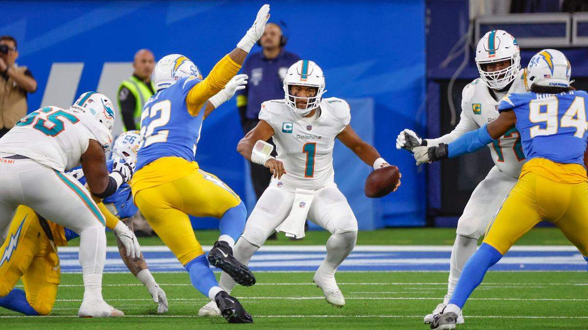 Miami Dolphins quarterback Tua Tagovailoa (1) scrambles during the game against the Los Angeles Chargers in the second quarter at SoFi Stadium in Inglewood, California on Sunday, December 11, 2022.