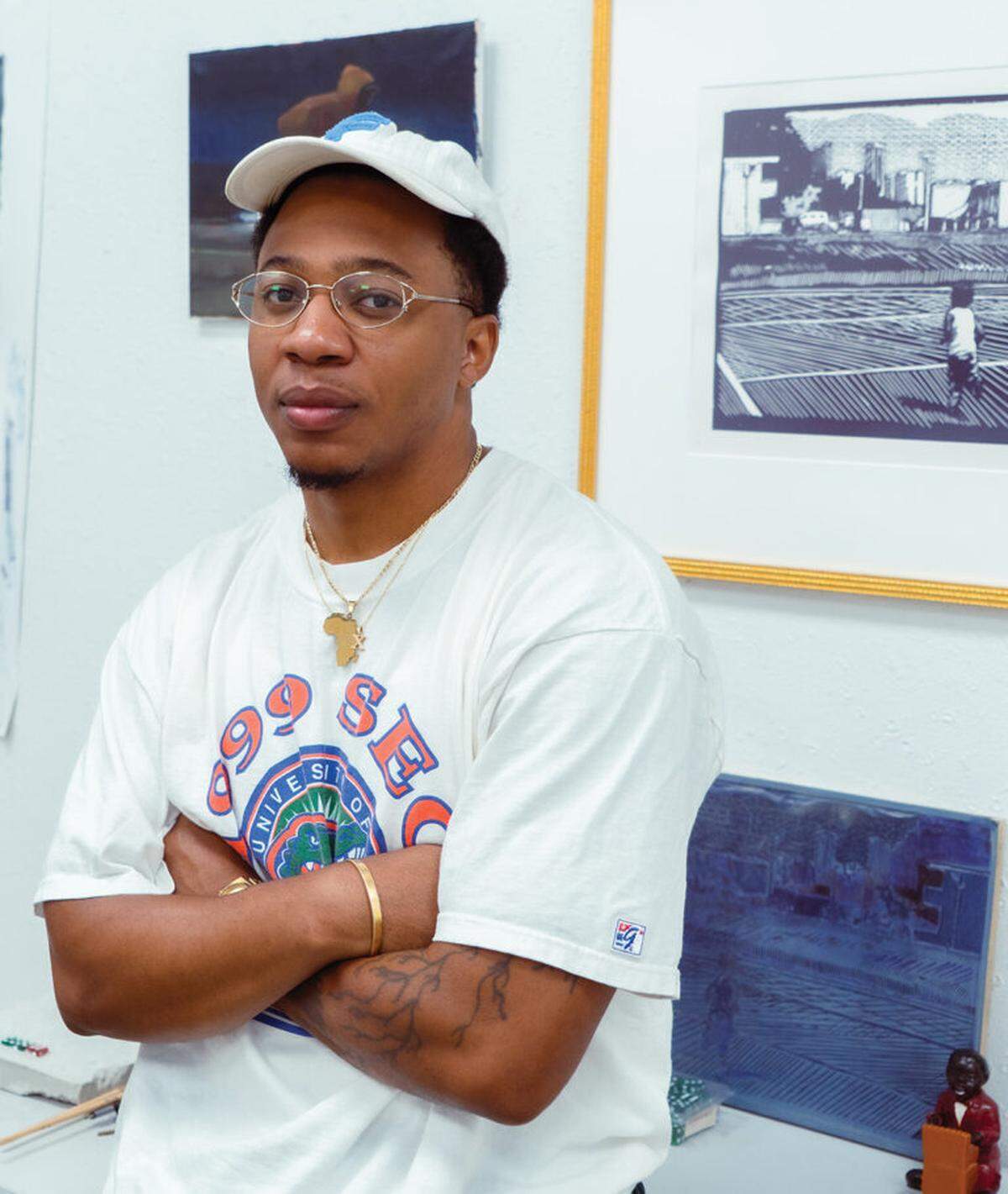 Reginald O’Neal is known for both his neo-impressionist paintings and for large-scale installations of souvenir caricature figurines reflecting on the historic commodification of Black creativity.