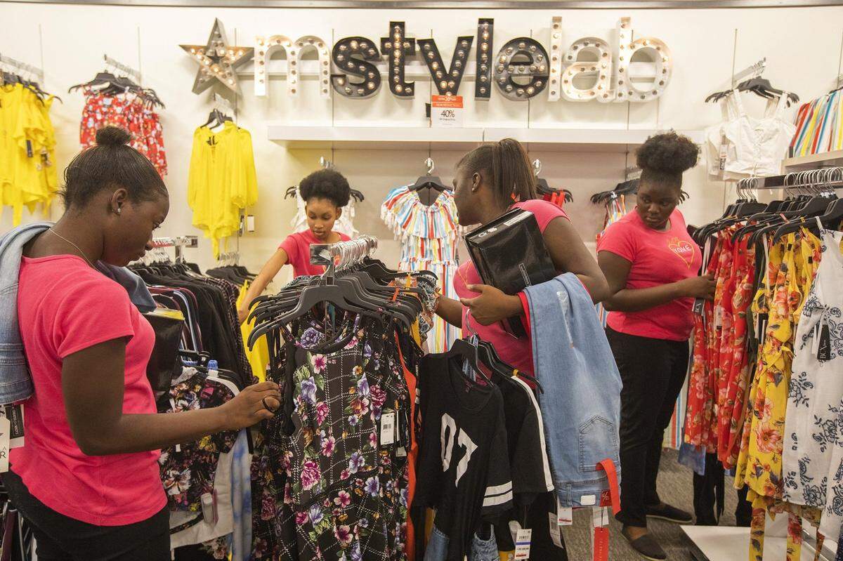 Carlandina Agenor,18; Stephanie Felix,18; Philomise Pierre, 18; Philonia Pierre, 18, a group from Youth of Valor Empowerment, shop as actor-singer Serayah McNeill of “Empire” performs at Macy’s Junior Department at Aventura Mall in 2018.