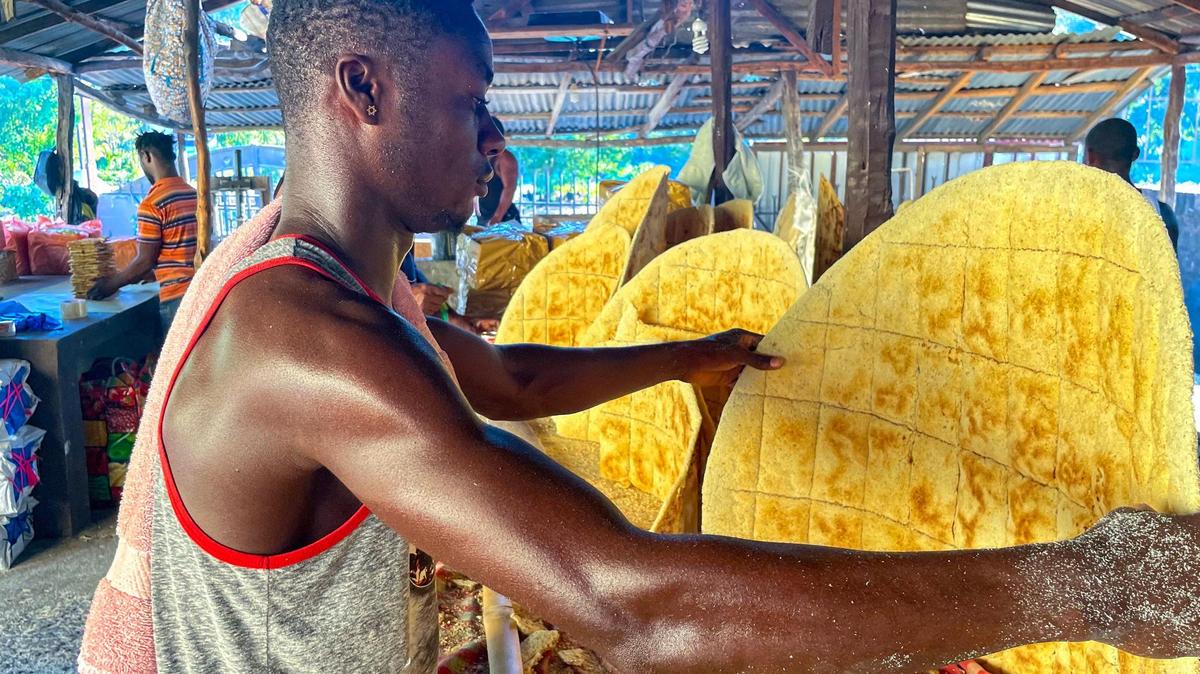 Josnel Pierre prepares kasav in Haiti, on Friday, January 20, 2023. The popular flatbread, made from cassava flour, is a staple food in the country and is still prepared the way it was made centuries ago with wooden knives and charcoal.
