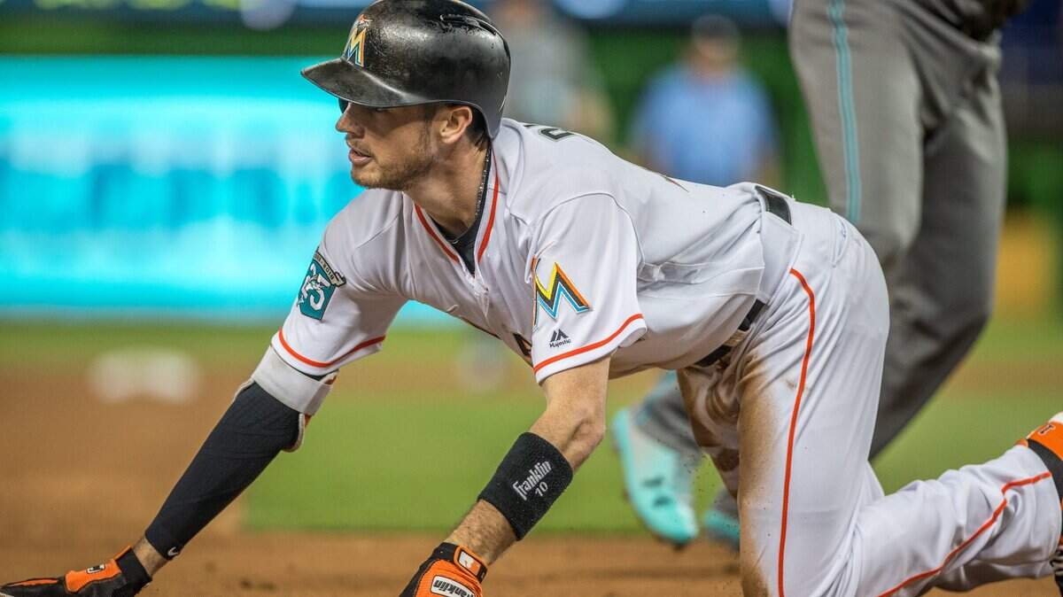 Miami Marlins shortstop JT Riddle (10) gets taken out on third after a triple attempt during the second inning of the game against Arizona Diamondbacks at Marlins Park in Miami, Tuesday, June 26, 2018.