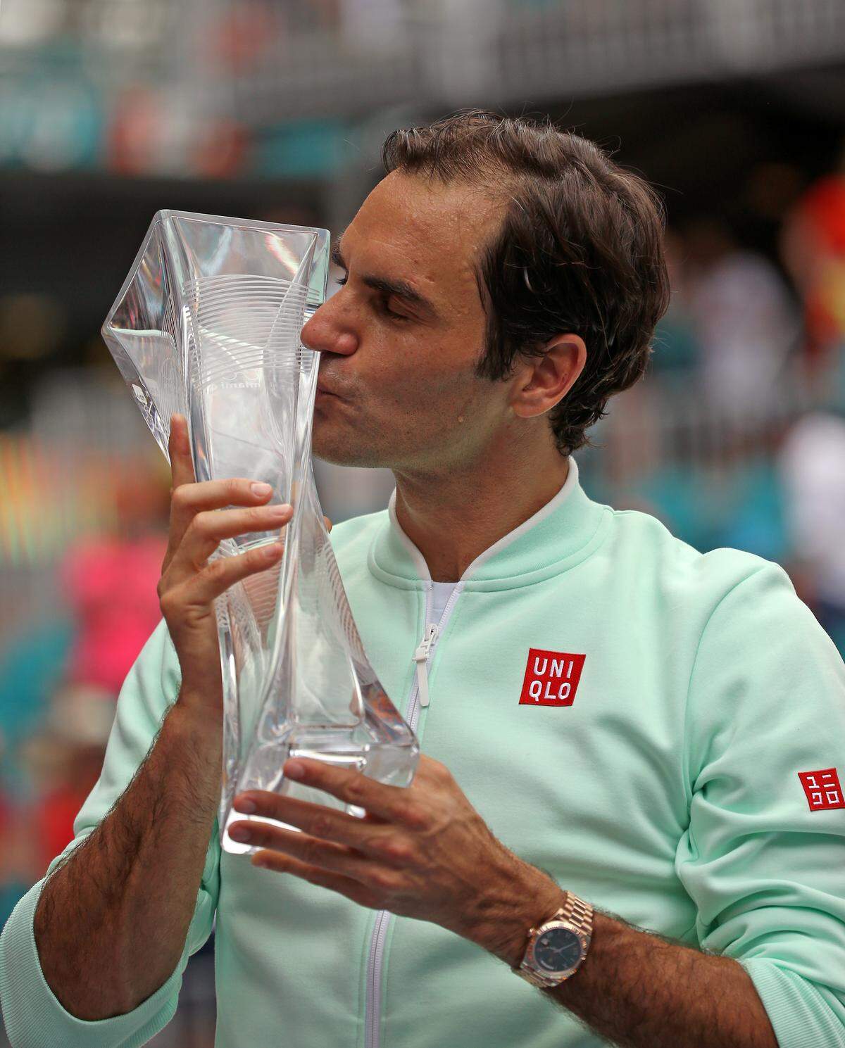 Roger Federer, of Switzerland kisses the trophy after defeating John Isner, of United States 6-1, 6-4 during the final of the Miami Open tennis tournament at Hard Rock Stadium on Sunday, March 31, 2019, in Miami Gardens, Fla.