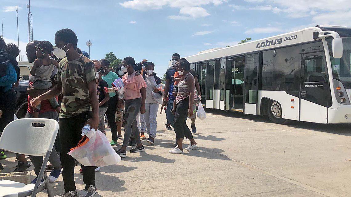 A group of Haitian migrants detained at the U.S.-Mexico border arrives in Port-au-Prince on Sept. 19, after being deported by the Biden administration.