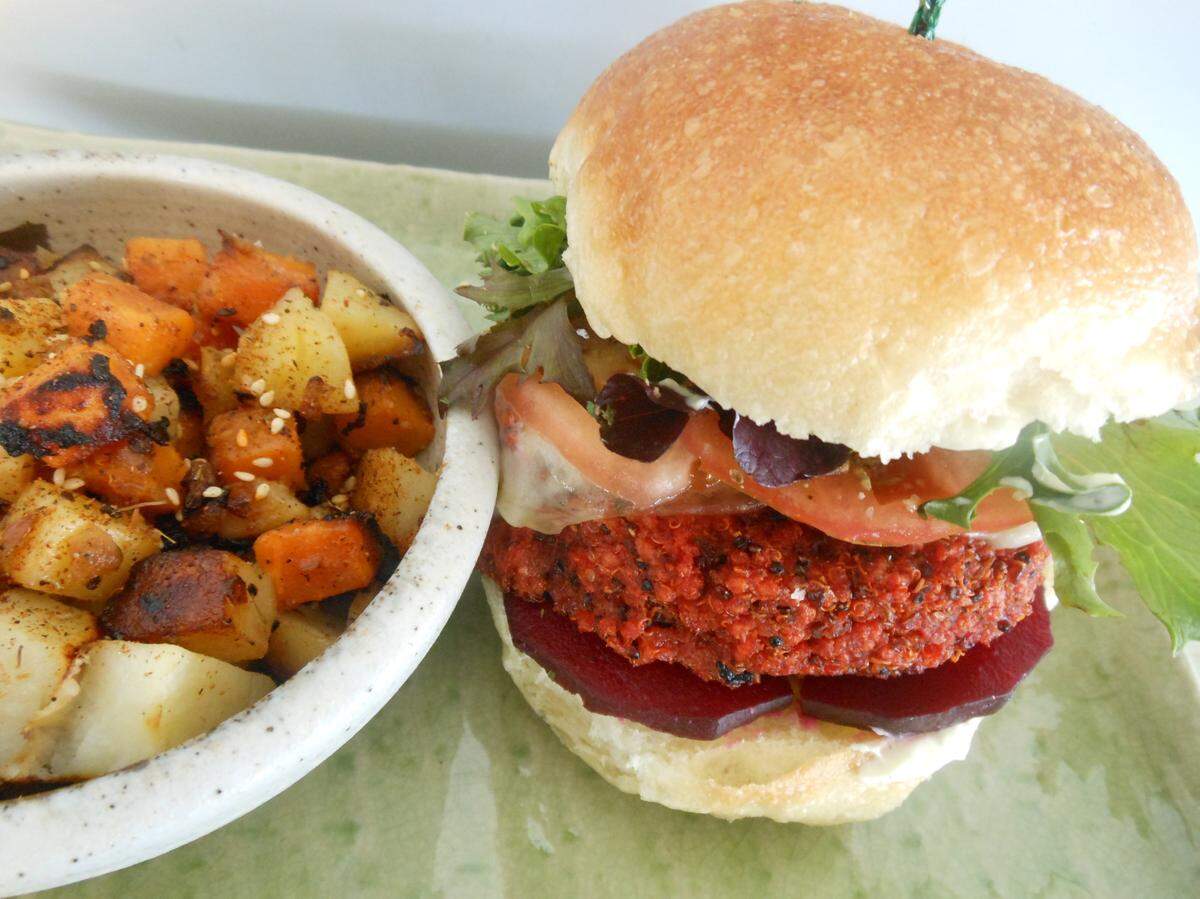 Veggie burger with pan-fried potato, sweet potato and boniato at Kuten Inclusive Kitchen.
