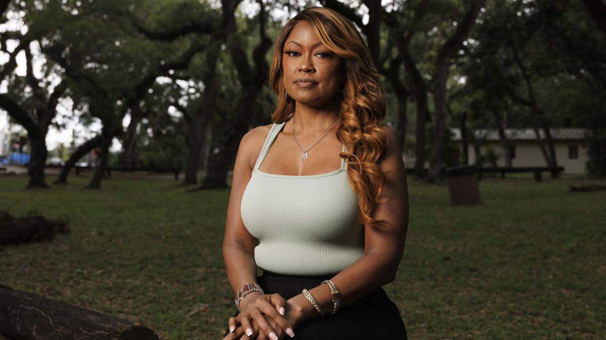 Cindy Doucet, otherwise known as SupaCindy, poses while reflecting on her story of abuse, and how she got away from her abuser on Wednesday, May 13, 2026, at Enchanted Forest Elaine Gordon Park in North Miami, Fla. 