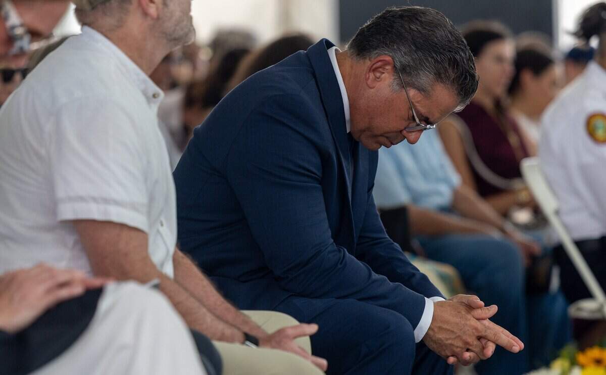 Omar Blanco, Florida State House Rep., lowers his head during a moment of silence at the fifth annual remembrance ceremony for the Champlain Towers South collapse in Surfside, Fla., on Wednesday, June 24, 2026.