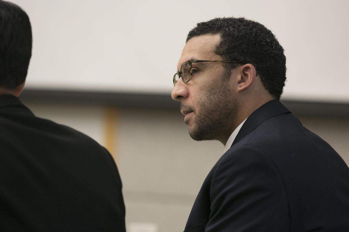Former NFL football player Kellen Winslow II looks at attorney Marc Carlos during his rape trial, Monday, May 20, 2019, in Vista, Calif.