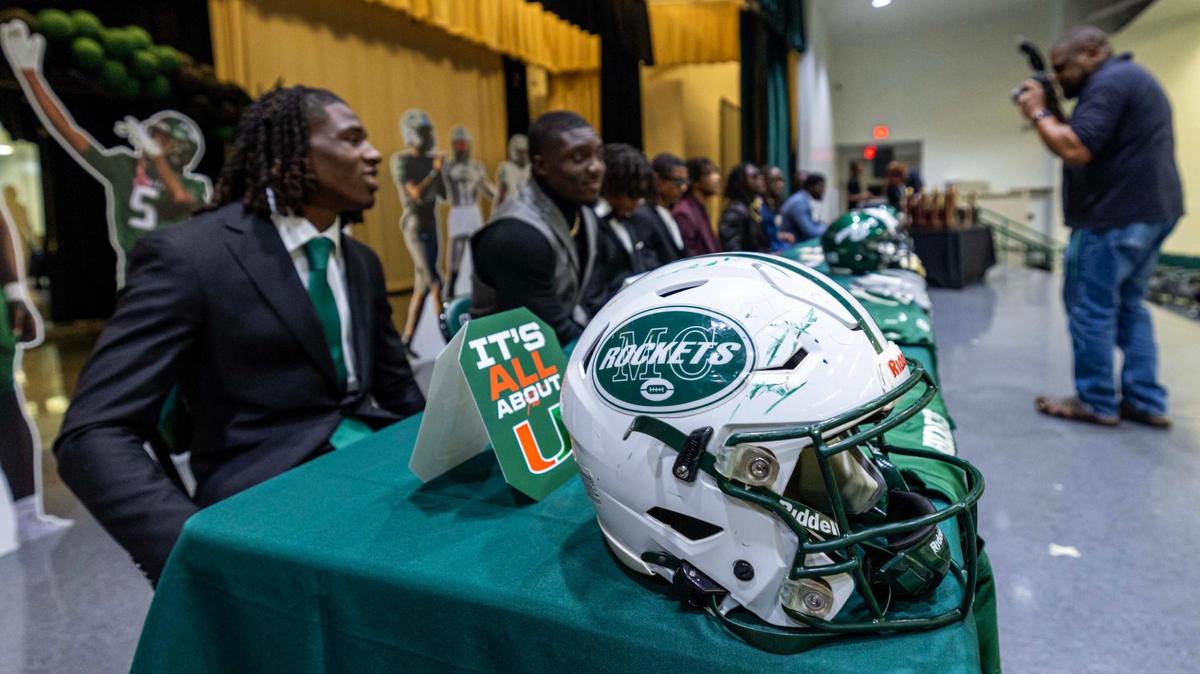 Ten players from Miami Central wait to sign with the university of their choice during signing day at Miami Central High School on Wednesday, Dec. 4, 2024, in Miami, Fla.