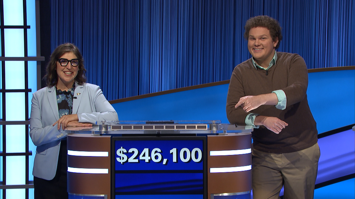 “Jeopardy!” host Mayim Bialik and 11-day champ Jonathan Fisher pose on the California set after Fisher’s run ended on an episode broadcast Tuesday, Oct. 26, 2021.