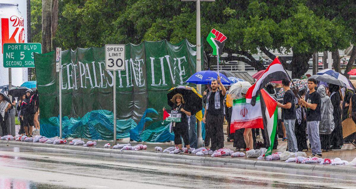 A group of people protested in support of the Palestinians in Gaza, on the Oct. 7 one-year anniversary of Hamas attack in Israel, in downtown Miami. The rally was organized by the South Florida Coalition for Palestine, and called for the Biden administration to stop sending weapons and funding to Israel.