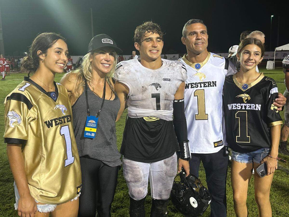 Western High quarterback Davi Belfort (middle), flanked by his parents, Vitor (right) and Joana (left) and his sisters, will lead the Wildcats against Palmetto in a Region 4-4M semifinal on Friday at Tropical Park.