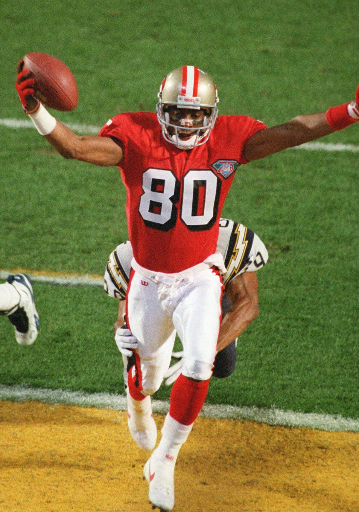 Jerry Rice celebrating the first of his three touchdown catches and quarterback Steve Young’s six touchdown passes in the Super Bowl XXIX rout of San Diego.