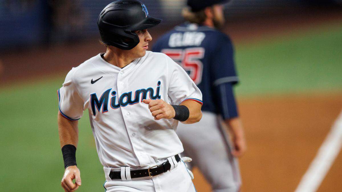 Miami Marlins center fielder JJ Bleday (67) scores on a single by teammate Miguel Rojas (11) during the fourth inning of a baseball game against the Atlanta Braves at LoanDepot Park on Sunday, August 14, 2022 in Miami, Florida.