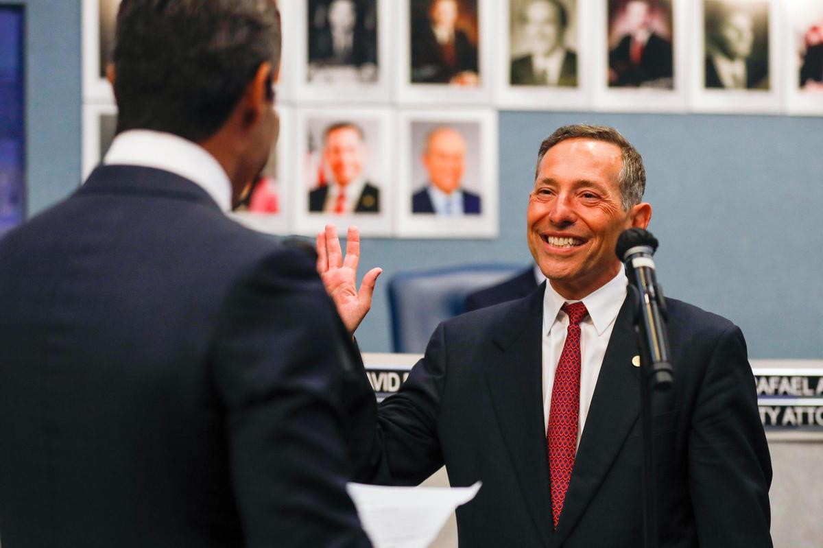 Miami Beach Commissioner Mark Samuelian gets sworn in for his second term by Miami Mayor Francis X. Suarez during a ceremony at Miami Beach City Hall on Monday, Nov. 22, 2021.