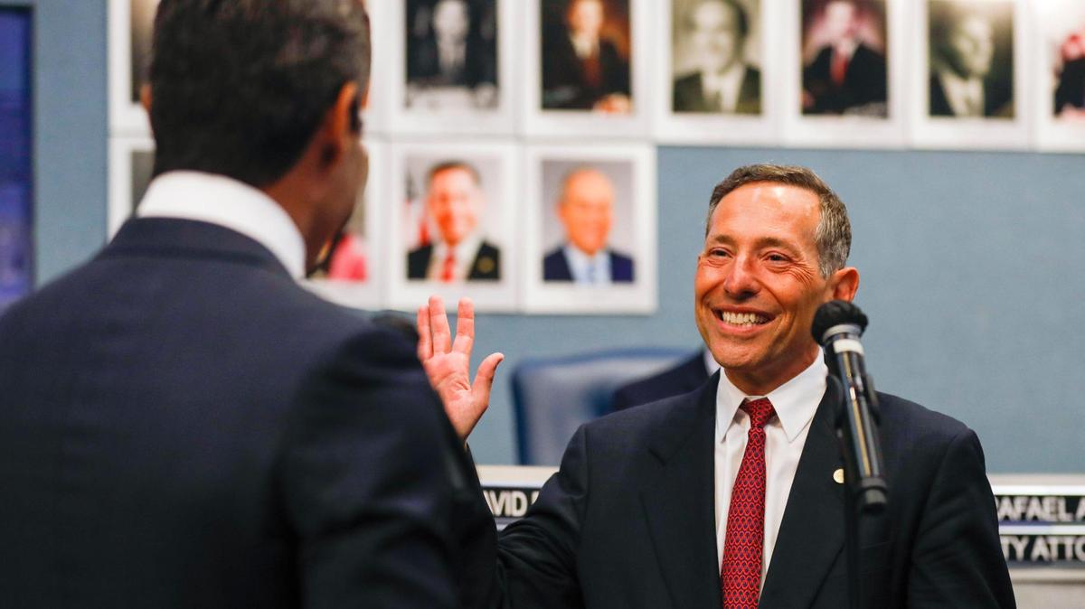 Miami Beach Commissioner Mark Samuelian gets sworn in for his second term by Miami Mayor Francis X. Suarez during a ceremony held at Miami Beach City Hall in Miami Beach, Florida, on Monday, Nov. 22, 2021.