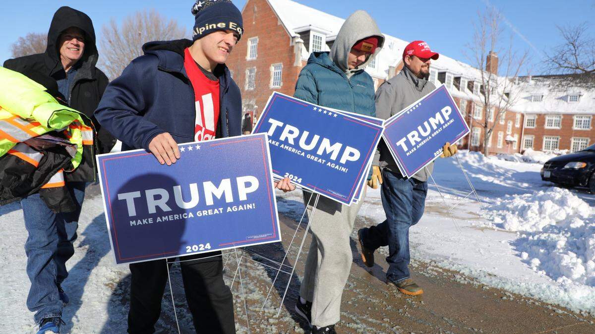 From left: Corky Boucher, 16, Toby Coucher, 14, and Bob Martindale, leave the Simpson College campus moments after attending a rally where former President Donald Trump spoke on Sunday, Jan 14, 2023, in Indianola, IA.