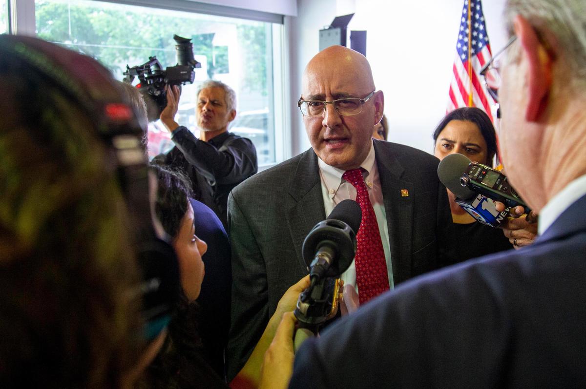 Rolando Montoya talks with reporters after he was appointed Miami Dade College interim president by the Board of Trustees during a meeting at the Wolfson Campus in Miami on Aug. 29, 2019.