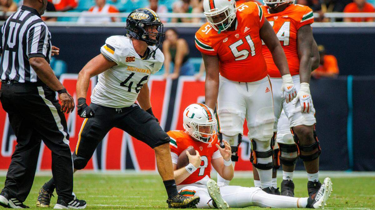 Southern Miss Golden Eagles linebacker Averie Habas (46) reacts after sacking Miami Hurricanes quarterback Tyler Van Dyke (9) during the second quarter of an NCAA non conference game at Hard Rock Stadium on Saturday, September 10, 2022 in Miami Gardens, Florida.