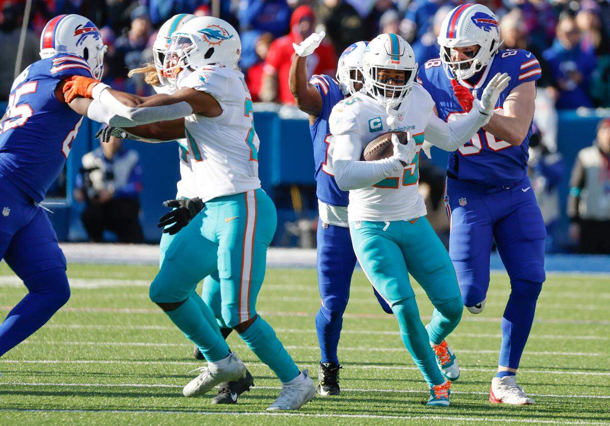 Miami Dolphins cornerback Xavien Howard (25) returns an interception against the Buffalo Bills during the NFL wild-card football game at Highmark Stadium, Orchard Park, NY, on Sunday, January 15, 2023.