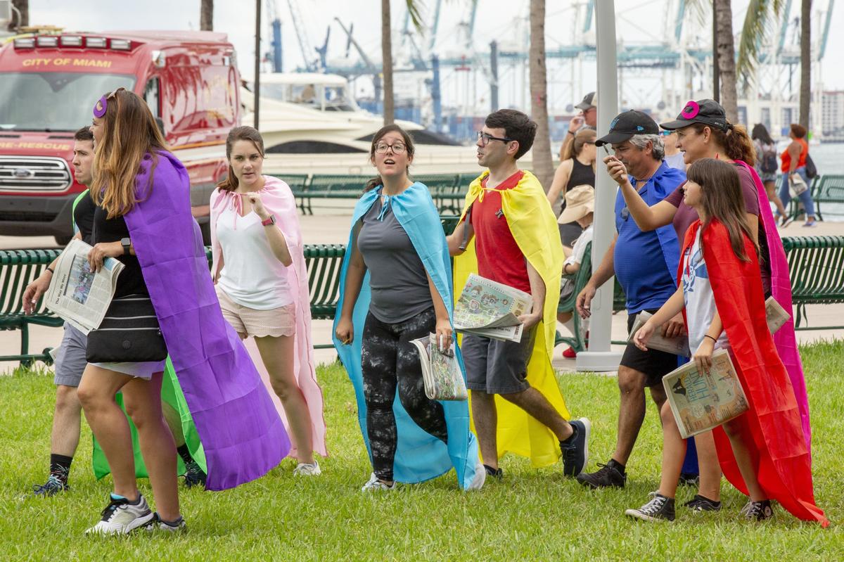 Team “Colonel Angus and the Caped Crusaders” search Bayfront Park for clues at the 2019 Herald Hunt.