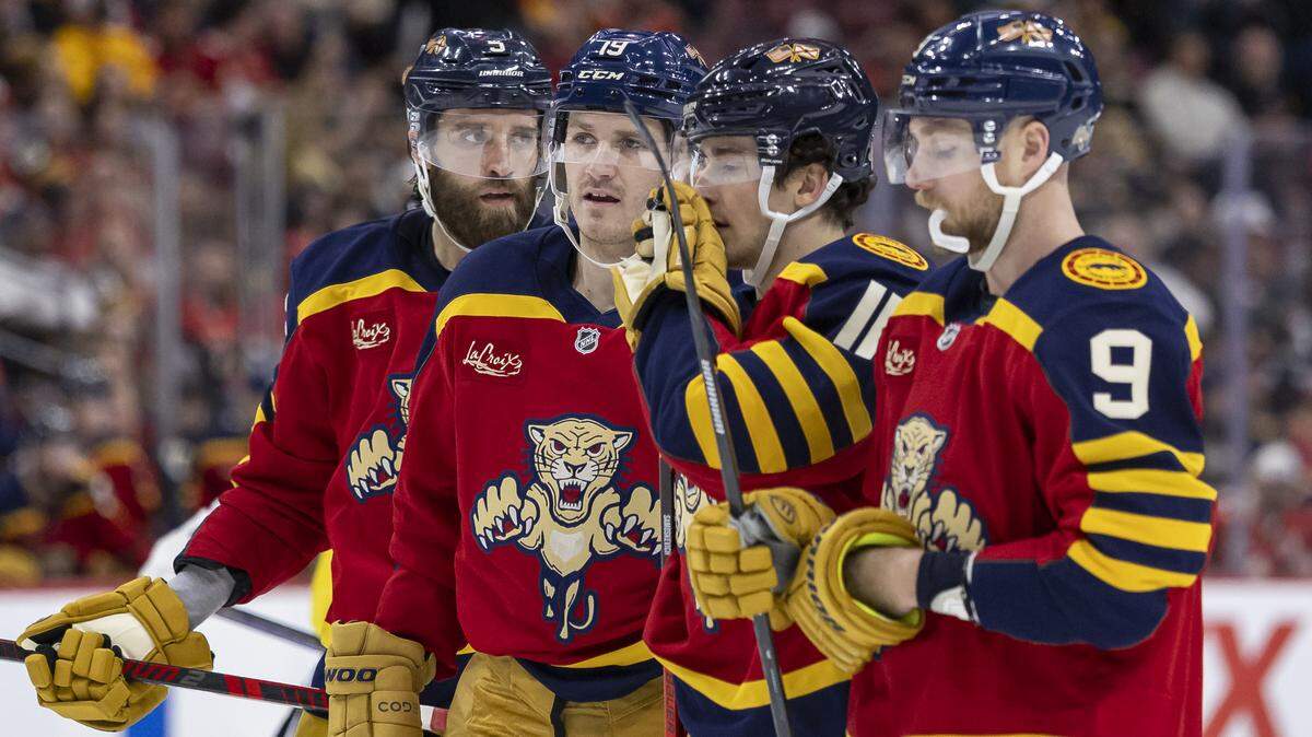 Florida Panthers defenseman Aaron Ekblad (5), left wing Matthew Tkachuk (19), right wing MacKie Samoskevich (11) and center Sam Bennett (9) talk during a timeout against the Boston Bruins in the third period of their NHL game at the Amerant Bank Arena on Wednesday, Feb. 4, 2026, in Sunrise, Fla.