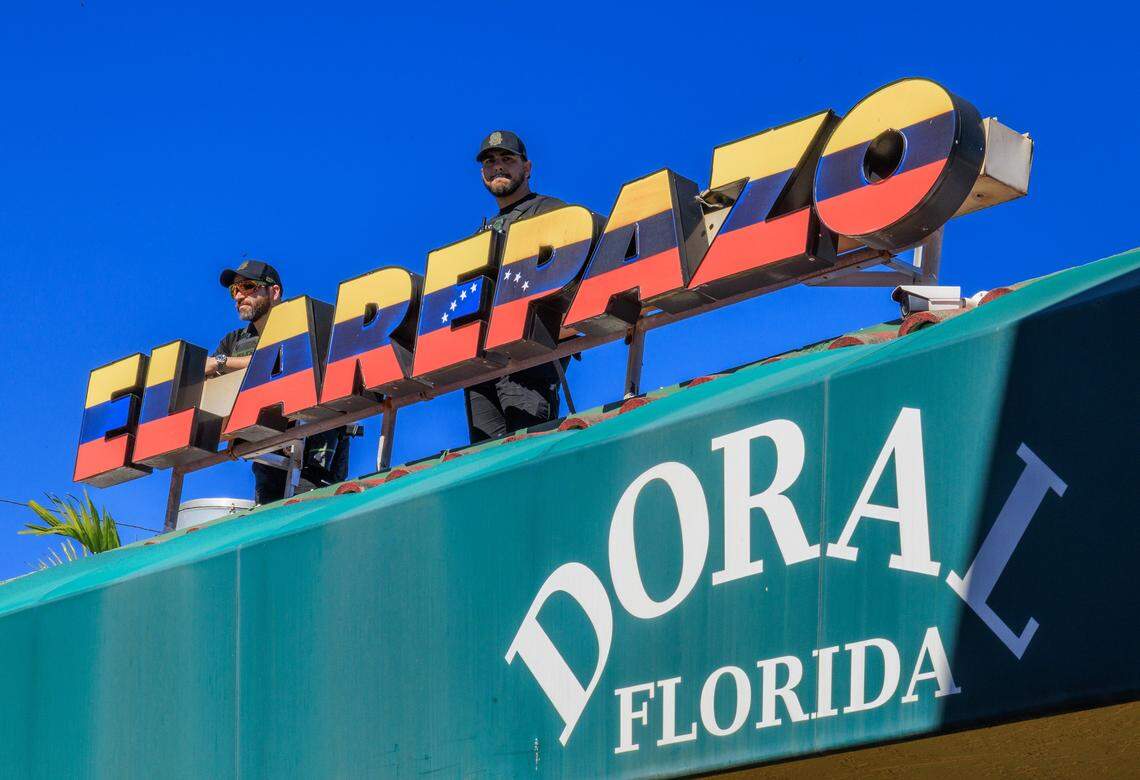 City of Doral Police officers seen on the roof guarding a celebration by Venezuelan exiles living in South Florida outside of El Arepazo in Doral, Florida, after the United States attacked Venezuela and captured Venezuelan leader Nicolás Maduro,  on Jan. 3, 2026.