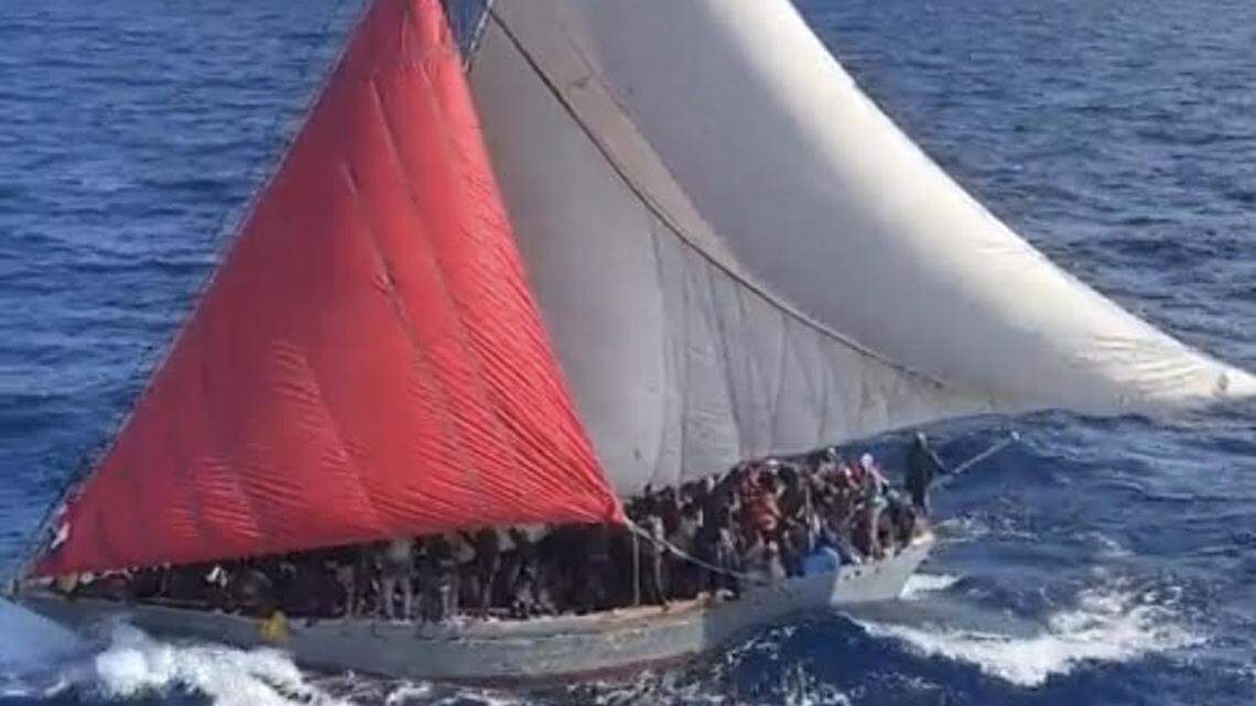 Close to 400 people crowd the deck of a Haitian migrant boat in the ocean near Cay Sal Bank in the Bahamas Sunday, Jan. 22, 2023.