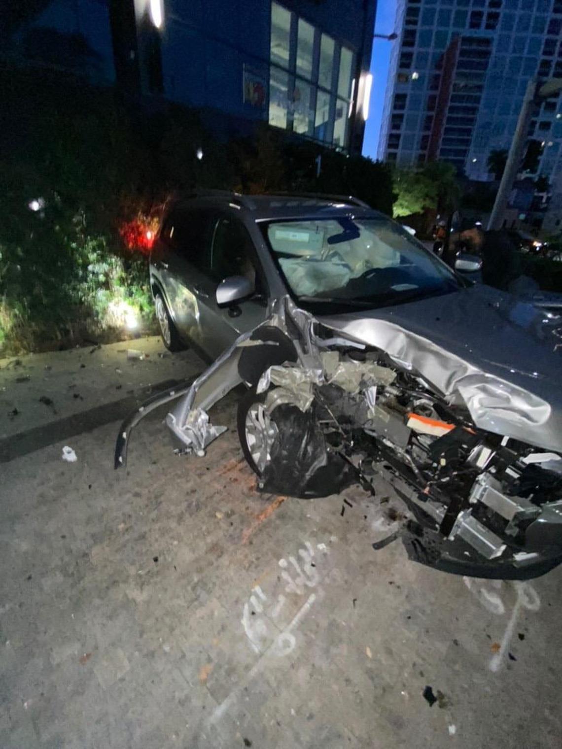 Silver Jeep Cherokee that hit a cyclist, light pole and tree on Brickell Avenue on Friday morning. The cyclist was not injured. The driver of the car fled the scene twice and has not been found.